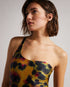 TELSA-Swimwear-Unleash your wild side with our Watercolour Leopard print. TELSA is a must-have for making a lasting impression at the beach, thanks to its striking print and unique one-shoulder style. Ted Baker womenswear collection Swimsuit One shoulder Crossover strap Scooped back cut out Straight neckline Ted Baker branded Mathea is 5'10.5" / 1.79m and wears Brown in a size S- Ted Baker Romania